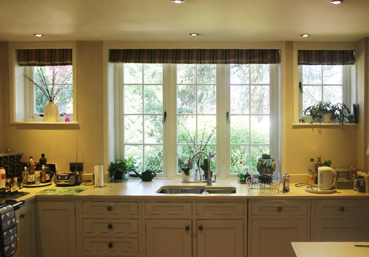 Unusual 1920's design with smaller casements either side in uniform panes